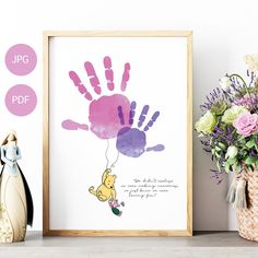 a hand print with a winnie the pooh quote on it next to some flowers