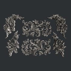 an ornate set of decorative elements on a dark background, in the form of filigrees and leaves