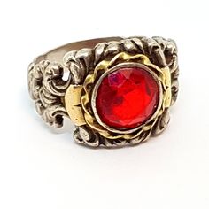 Art deco lovers, this ring is for you! Art deco ring, made of silver, gold and garnet simile, very normal at that time. Circa 1940. Weight: 8.44 grams. Ring dimensions: 21.4 mm which corresponds approximately to a size 12 USA. Composition: Silver, gold and ruby simile. No seal, acid test performed. To see photos. The condition is good, with signs of wear. It is not new, please see the photos, which are an important part of the description. See the photos for your own impression (note that the ph Vintage Garnet Ring With Center Stone, Vintage Red Hallmarked Signet Ring, Antique Ruby Signet Ring, Vintage Ruby Signet Ring Hallmarked, Antique Hallmarked Ruby Signet Ring, Vintage Hallmarked Ruby Signet Ring, Handmade Vintage Ruby Ring For Anniversary, Handmade Vintage Crystal Ring For Formal Occasions, Art Deco Silver Ruby Ring For Anniversary