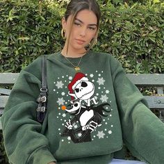 Long Sleeve Cartoon Print T-shirt For Winter, Oversized Christmas Crew Neck Sweatshirt, Oversized Crew Neck Christmas Sweatshirt, Winter Crew Neck Sweatshirt With Cartoon Print, Winter Crew Neck Sweatshirt With Character Print, Winter Cartoon Print Crew Neck Sweatshirt, Winter Crew Neck Tops With Screen Print, Winter Cartoon Print Relaxed Fit Tops, Casual Christmas Sweatshirt With Cartoon Print