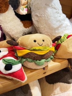 Jellycat Amuseable Burger.

Coming with a plethora of colour, this bundle of fun will definitely brighten up your day with its brown burger middle, cheesey topping, salad bed and red saucey garnish.

The soft squidgy bun comes with the classic little smiley face and brown cordy arms.

This is a real treat for foodies! Jellycat Display, Cat Burger, Therapy Cat, Wet Clothes, Toy Rooms