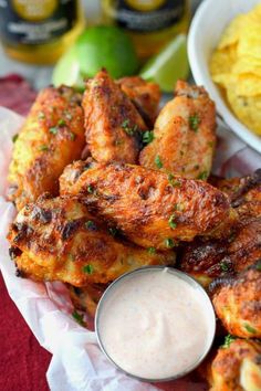 chicken wings with dipping sauce on the side