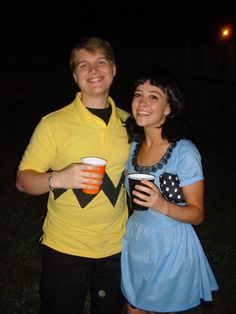 a man and woman dressed up in costumes