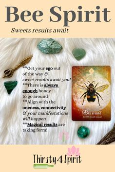 a bee spirit card surrounded by crystals and stones