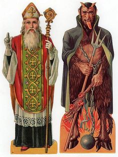 an image of two men in costumes with different designs on their faces and body, one holding a staff