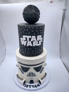 a star wars themed cake with a helmet on top