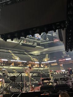 an empty concert hall filled with lots of seats and lights on top of the stage