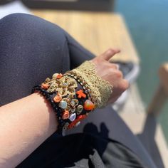 This beautiful enique Desıgn black fabric bracelet is made with bright and shine rhinestone, orange gemstone cross, embroidered orange flowers and Vintage gold color wide lace.  Ideal both for day and night to match your dresses.    Perfect gift for your loved ones on special occasions like birthdays or on the Mother's Day. Bohemian Orange Beaded Bracelets For Party, Black Embroidered Bohemian Jewelry, Bohemian Black Embroidered Jewelry, Embroidered Orange, Fabric Bracelets, Wrist Bracelet, Hippie Bracelets, Flowers Black, Wrist Cuffs