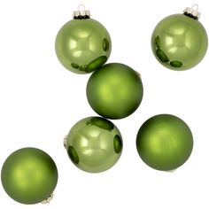 green christmas ornaments are arranged in the shape of an xmas tree ornament