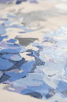 an abstract painting with blue and gray colors on it's surface, including the paint