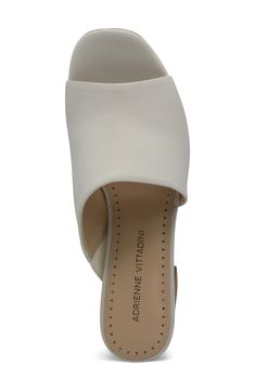 An asymmetrical strap creates a unique touch on this classic open toe mule. 3.5" heel Open toe Asymmetrical vamp Slip-on Block heel Manmade upper, lining, and sole Imported Modern Open Toe Mules With 4-inch Heel, Elegant Slip-on Sandals With Sculpted Heel, Formal Open Toe Mules With 4-inch Heel, Evening Slip-on Mules With Heel Strap, Evening Slip-on Sandals With 4-inch Heel, Evening Sandals With 4-inch Heel, Slip-on, Elegant Slip-on Sandals With Heel Strap, Evening Open Toe Mules With 4-inch Heel, Elegant Open Toe Mules With Padded Heel