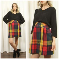 "Classic, Colourful Pleated Mini Skirt with Large Plaid Pattern & fun 70s aesthetic ~ there is a thick waistband with cross over front, three brass buttons & one interior button ~ there are side pleats, a Full Silhouette and Cute Wooden Safety Pin!  Excellent Vintage Condition: like new Label: Removed.  Best Fit: Small - Medium Waist: 28\" Hips: 44\"  Length: 20.5\" Model Measurements: Bit loose at the high-waistline & hips Bust: 33.5\" / Waist: 27\" - 28\" Hips: 38\" / Height 5'9\" *Please Refer to Our Shop Policy at Bottom of Main Page for Vintage Shopping Standards* *Please notify seller if item is required for a specific date & feel free to message for further detail* *Pricing reflects the rarity & significance of the item, condition & cost of shipping*" Retro Skirt With Button Closure For Fall, Retro Fall Skirt With Buttons, Vintage Fall Skirt With Buttons, Vintage Skirt Bottoms With Buttons, Vintage Pleated Mini Skirt, Vintage Fitted Mini Pleated Skirt, Vintage Mini Skirt With Buttons, Vintage Buttoned Mini Skirt, Retro Plaid Mini-length Bottoms