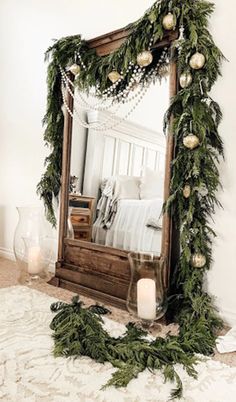 a mirror sitting on top of a wooden floor next to a white fireplace mantel