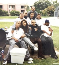 a group of people sitting on top of a bench