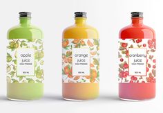 three bottles of juice with different flavors and designs on them, one is orange, the other is green