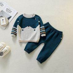 When you put on this adorable sweater set, you will be the cutest bear in town. This sweater will keep you warm and cozy with buttons at the shoulders and long sleeves. The pants have an elasticized drawstring waistband so you can feel comfortable all day long. This set will surely be a hit with your friends! Material: Cotton Winter Knit Long Sleeve Sets, Casual Knit Sets For Winter, Winter Long Sleeve Knit Sets, Cozy Playtime Sets For Fall, Cozy Long Sleeve Sets For Fall, Playful Long Sleeve Sets For Fall, Cute Winter Playtime Sets, Playful Blue Sets For Fall, Playful Blue Sets For Winter