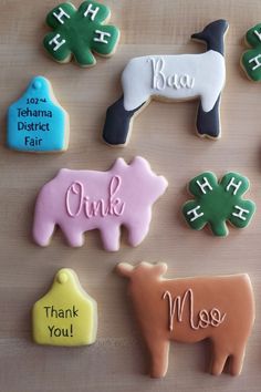 overhead view of multiple cookies in animal shapes; one sheep, one pig, and one steer designed sugar cookies Lamb Sugar Cookies Decorated, County Fair Gift Baskets, Pig Cookies Royal Icing, 4-h Display, 4h Cookies Decorated, Sheep Sugar Cookies Decorated, Show Cattle Graduation Party, 4h Themes Ideas