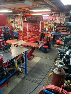 a garage filled with lots of tools and equipment