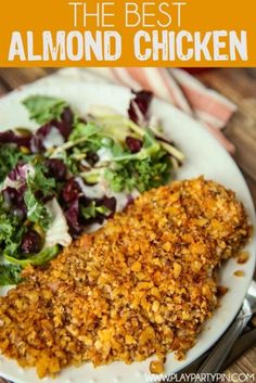 a white plate topped with chicken and salad