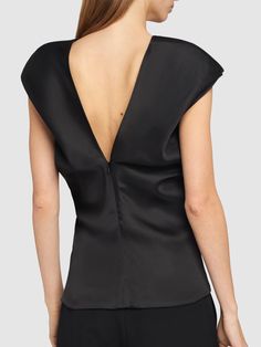 Concealed back zip closure. Model is wearing a size2 Elegant Cowl Back Top For Evening, Elegant Structured Evening Tops, Elegant Fitted Top With Padded Shoulders, Elegant Fitted Tops With Padded Shoulders, Elegant Structured Tops For Night Out, Elegant Party Tops With Back Zipper, Elegant Black Top With Back Zipper, Chic Evening Tops With Back Zipper, Structured Fitted Blouse For Formal Occasions