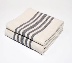 two black and white towels folded on top of each other