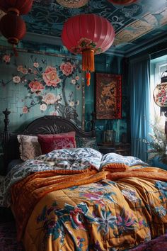 a bed room with a neatly made bed and two red lanterns hanging from the ceiling