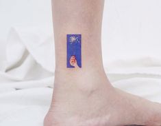 a person with a small tattoo on their foot