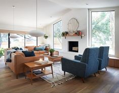 a living room filled with furniture and a fire place