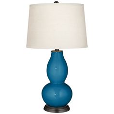 a blue lamp with a white shade on it