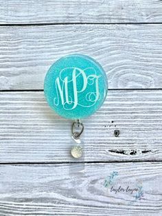 "PLEASE READ FULL DESCRIPTION BEFORE PURCHASING This listing is for a 2\" Cute Monogram Badge Reel Badge Reel Holder. This is made out of 1/8 in thick acrylic and decorated with vinyl and then a protective, shiny layer of UV resin. Acrylics are permanently adhered to a clear swivel retractable alligator clip that extends to 35\"(belt clips are available as well ONLY when requested by Buyer). CARE INSTRUCTIONS: *Do not leave in extreme heat or cold. *Please handle with care - acrylics can break i Cheap Personalized Themed Badge Reel, Cheap Customizable Blue Badge Reel, Mermaid Badge Reel, Novelty Personalized White Badge Reel, Pink Personalized Novelty Badge Reel, Personalised Badges, Custom Badges, Uv Resin, Badge Holders Lanyard