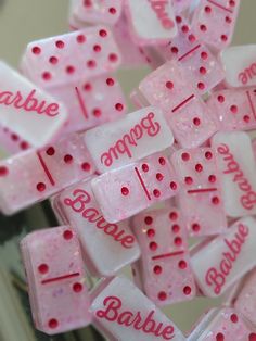 pink and white baby blocks with words on them that say bubble gums, baube & more