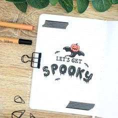 an open notebook with the words let's get spooky on it