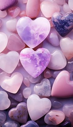 many different colored heart shaped rocks together