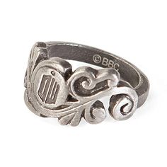 a silver ring with an ornate design on it