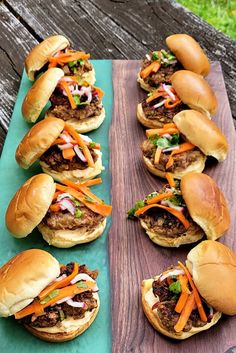 several hamburgers are lined up on a table