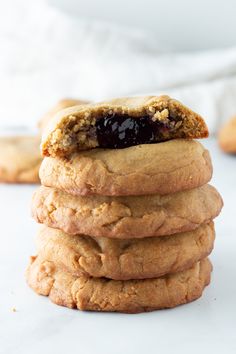 a stack of cookies with jam on top