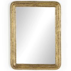 a gold framed mirror against a white wall