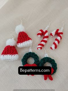 crocheted christmas ornaments are displayed on a table