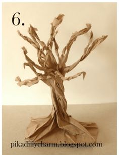 a tree made out of brown paper with the number 6 on it's base