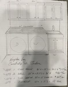 this is a drawing of a kitchen with cabinets and an island in the middle, on top of a sheet of paper