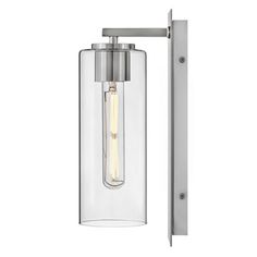 an outdoor light fixture with a glass cylinder and metal frame on the outside of it