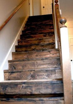 the stairs are made from wood and have metal handrails