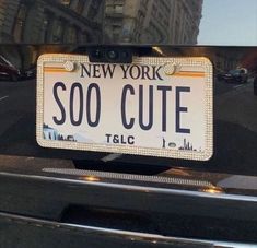 a new york license plate on the hood of a car