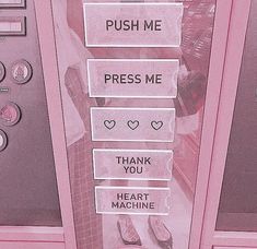 two pink vending machines that say push me, press me, thank you and heart machine