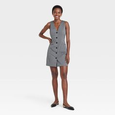 Switch up your style game with this Tailored Mini Vest Dress from A New Day™. The sleeveless dress is made of midweight recycled polyester-rayon woven fabric with added spandex to lend just the right amount to stretch for flexible all-day comfort. Tailored in a mini-length silhouette with a flattering neckline, the vest dress is fashioned in a classic pinstripe pattern with a row of buttons down the front and welt pockets for functional flair, perfect for taking your look from AM to PM with ease Vest Dress Outfit, Dress Layered, Maxi Bodycon Dress, Ballet Dress, Ruched Midi Dress, Flare Mini Dress, Mini Skater Dress, Sweater Dress Midi, Women Maxi