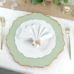 a place setting with napkins and silverware