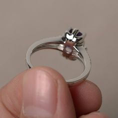 This is a gorgeous handmade creation. Its beauty is its simplicity & Elegance. The 6*8 mm cushion cut faceted natural Amethyst is crafted in solid sterling silver and with rhodium plated. All item is sent in a beautiful gift box If you have any idea of design your ring,pls contact me directly. You can realize more lovely stuff clicking the link https://www.etsy.com/shop/knightjewelry?refshopsection_shophome_leftnav Please leave the correct address and you phone number for delivering successf Asscher Cut Promise Ring With Halo Design, Asscher Cut Halo Design Promise Ring Jewelry, Asscher Cut Halo Design Promise Ring, White Gold Sapphire Ring With Cushion Cut Diamond, Oval Amethyst Ring With Prong Setting In Cubic Zirconia, Oval Amethyst Ring With Cubic Zirconia In Prong Setting, Asscher Cut Crystal Promise Ring With Prong Setting, Anniversary Cushion Cut Cluster Ring With Halo Setting, Adjustable Rings With Center Stone For Anniversary