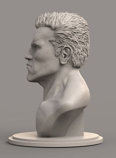 a white sculpture of a man's head with hair on the top and bottom