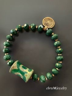 Green Spiral Bracelet - EBRU JEWELRY Green Beaded Bracelets With Large Beads As Gift, Green Beaded Bracelet With Gold Beads, Green Spiritual Bead Bracelet, Bohemian Green Beaded Bracelets With Gold Beads, Elegant Green Beaded Bracelets With Large Beads, Green Rondelle Beaded Spiritual Bracelets, Green Spiritual Rondelle Beaded Bracelets, Green Spiritual Bracelet With Spacer Beads, Handmade Green Beaded Bracelets For Meditation