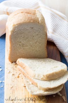 a loaf of bread sitting on top of a wooden cutting board